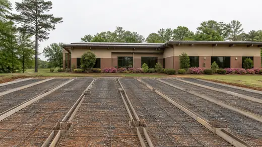 Long parking lot strips formed and reinforced ready to pour in Savannah, GA, under an overcast sky.